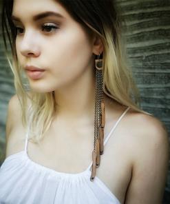 Long tan leather earrings.