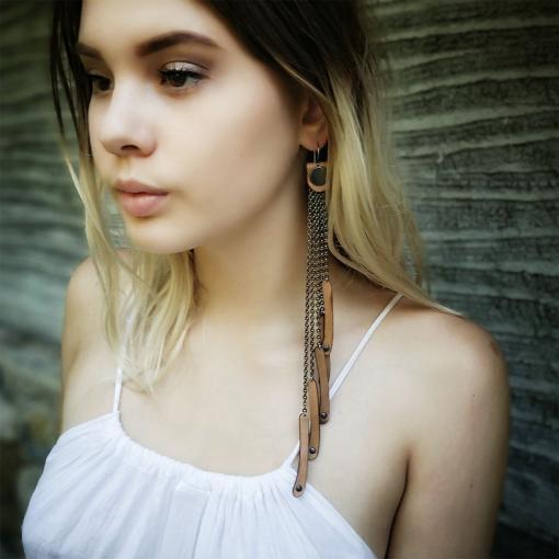 Long tan leather earrings.