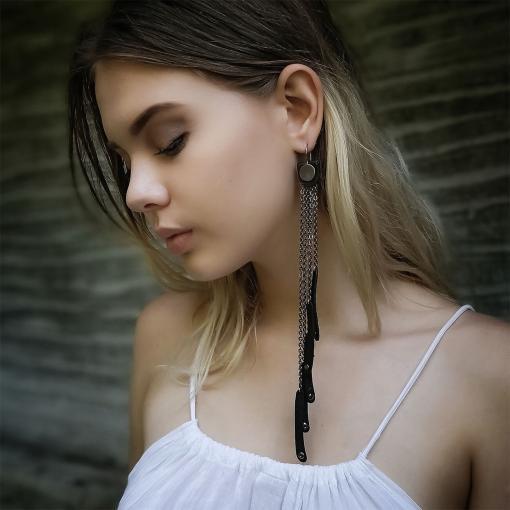 Long leather and chain tassel earrings.