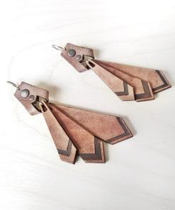 Tan leather dangle earrings.