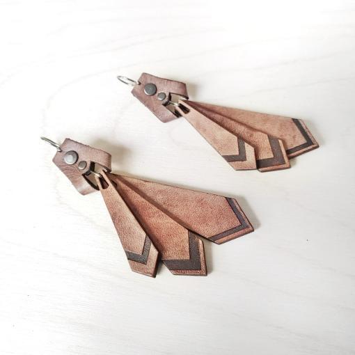 Tan leather dangle earrings.