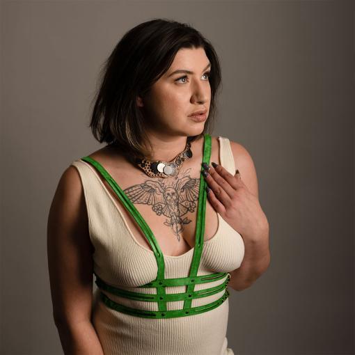 Green leather body harness.